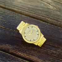Titan Quartz Analog with Day and Date Golden Dial Stainless Steel Strap Watch for Men