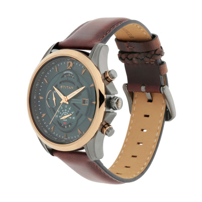 Angled view of Titan Maritime men’s chronograph watch with green dial, gold bezel, & leather strap.